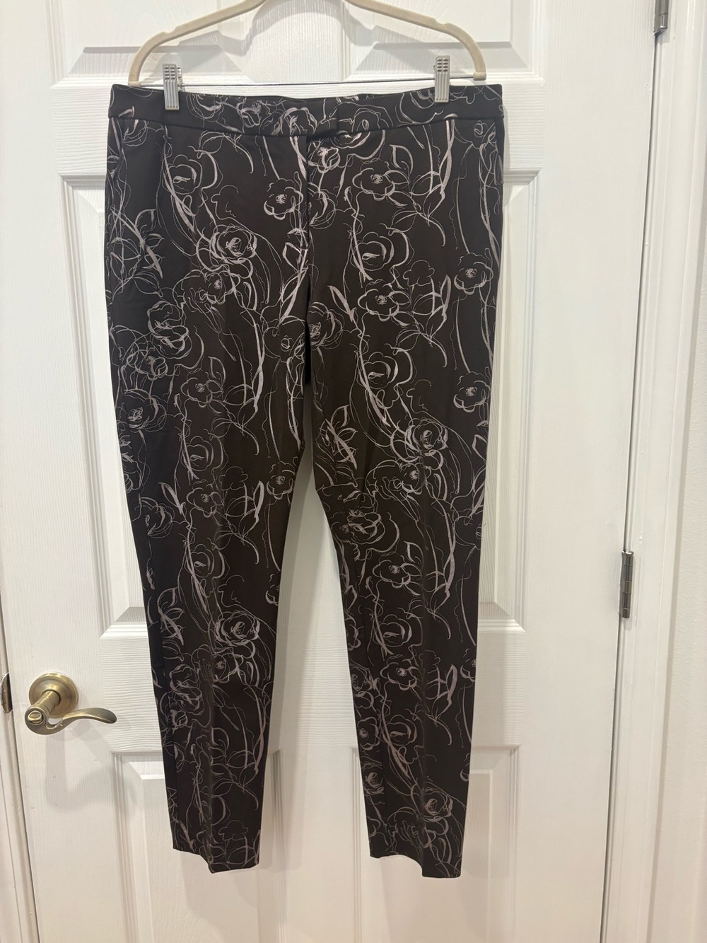 Alfani brown pants detailed with a white abstract scribbled floral pattern